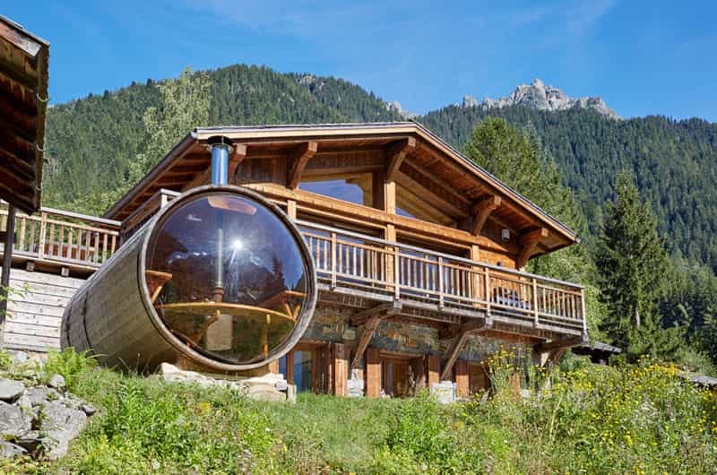 an outdoor sauna in the mountains