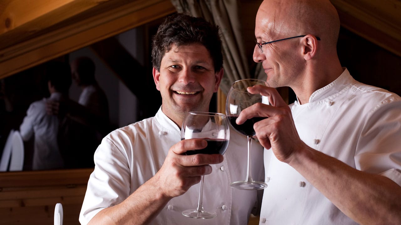 image of two chefs enjoying a glass of wine